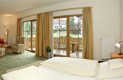 Bett im Garten Suite