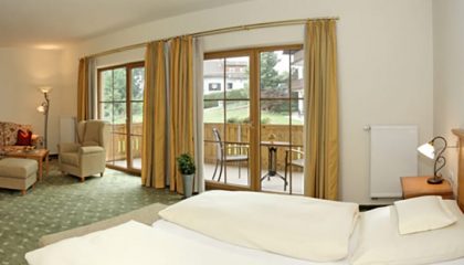 Bett im Garten Suite