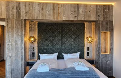 Bett in der Panorama-Suite Bergblick